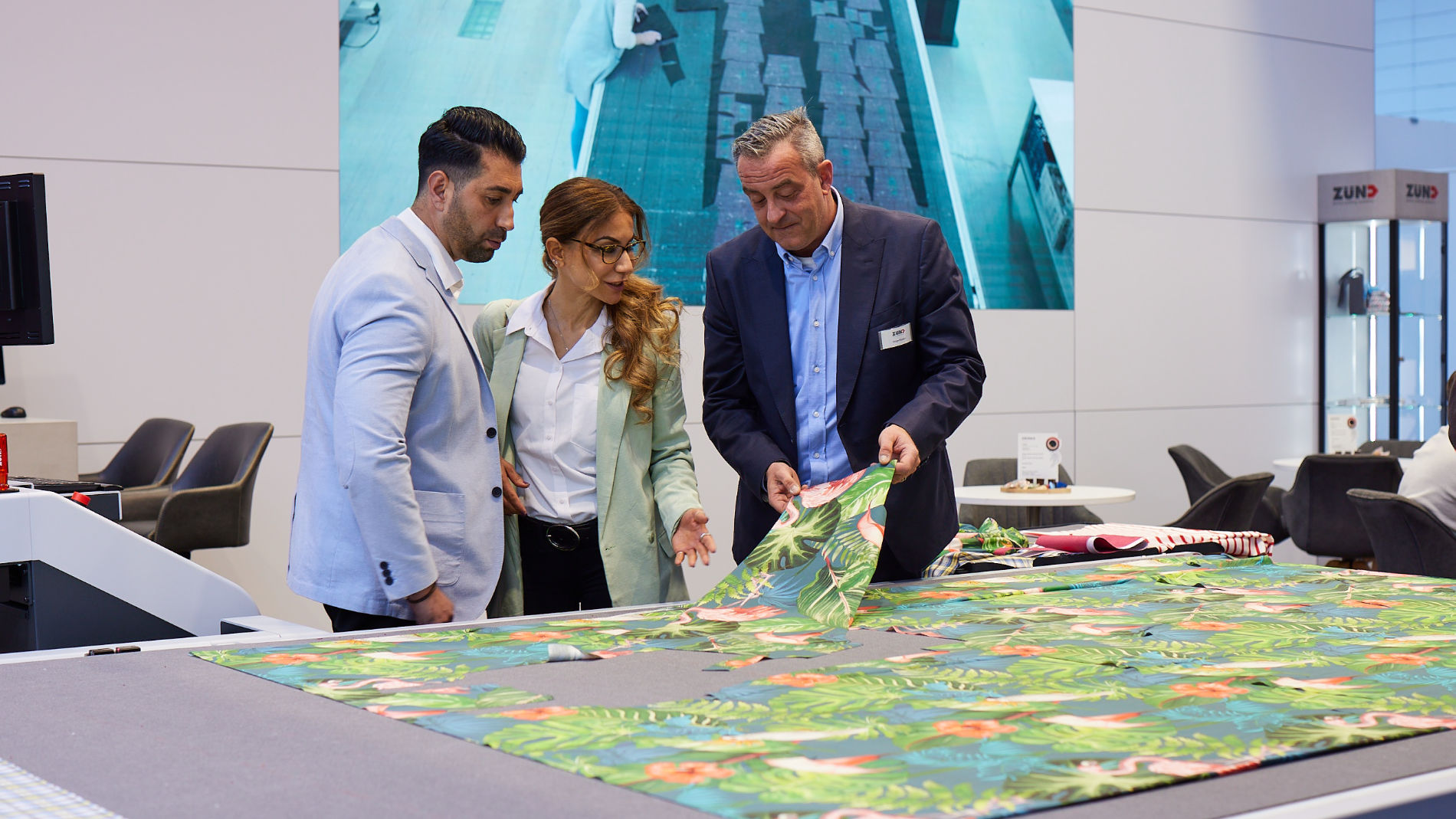 Exhibitors and visitors sitting at a stand