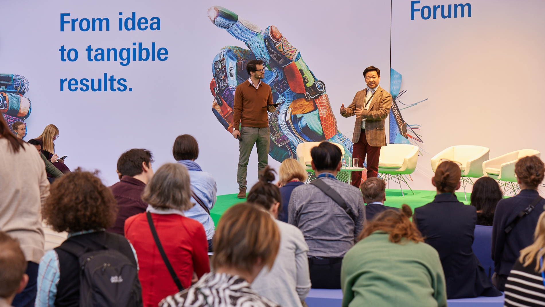 Visitors attend a presentation at the Texprocess Forum